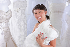 UC Irvine breast cancer patient Binh Phan looks at wedding gowns