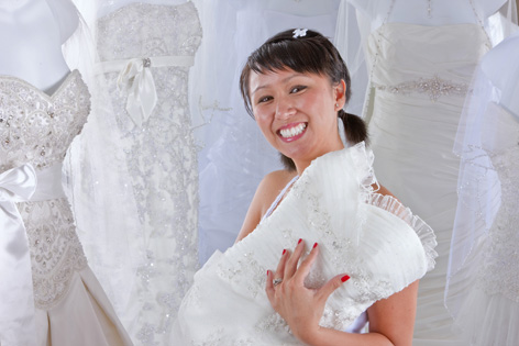 Breast cancer survivor Binh Phan trying on wedding dresses